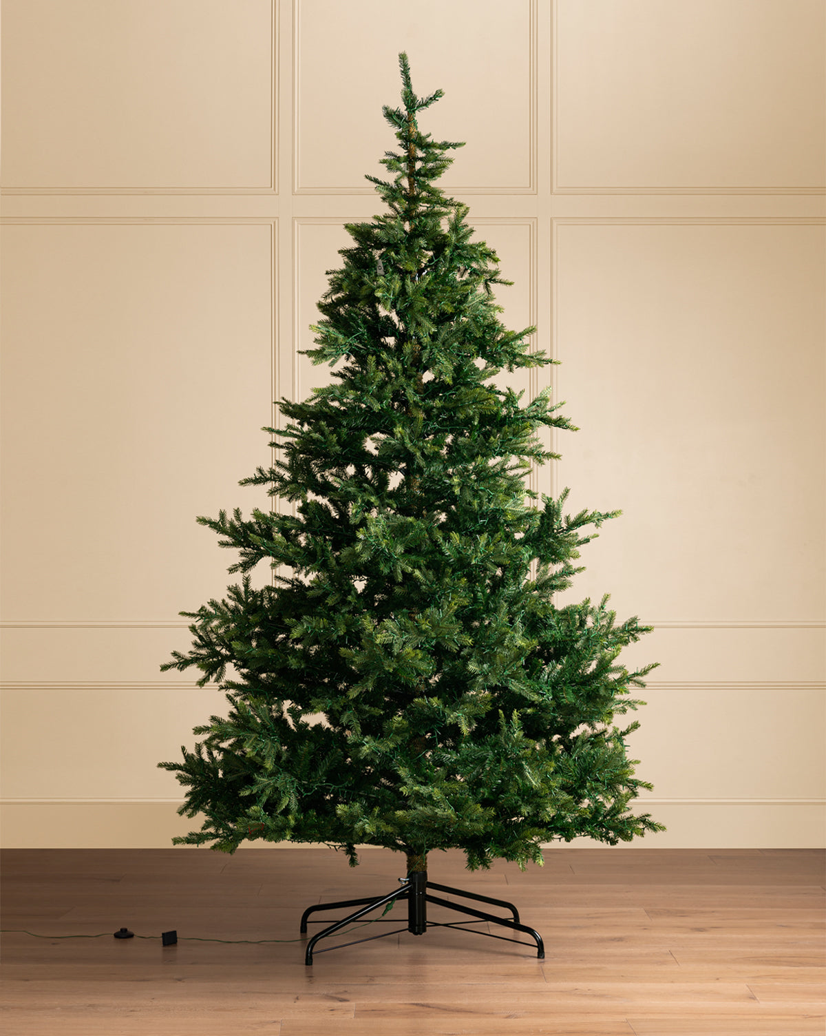 An electric cord beside the tree is ready to light up your holiday celebrations, by Vendixs