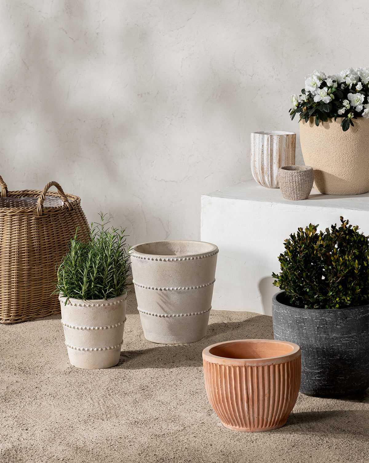 Assorted planter arrangement in various terracotta finishes for outdoor and indoor decor by Vendixs