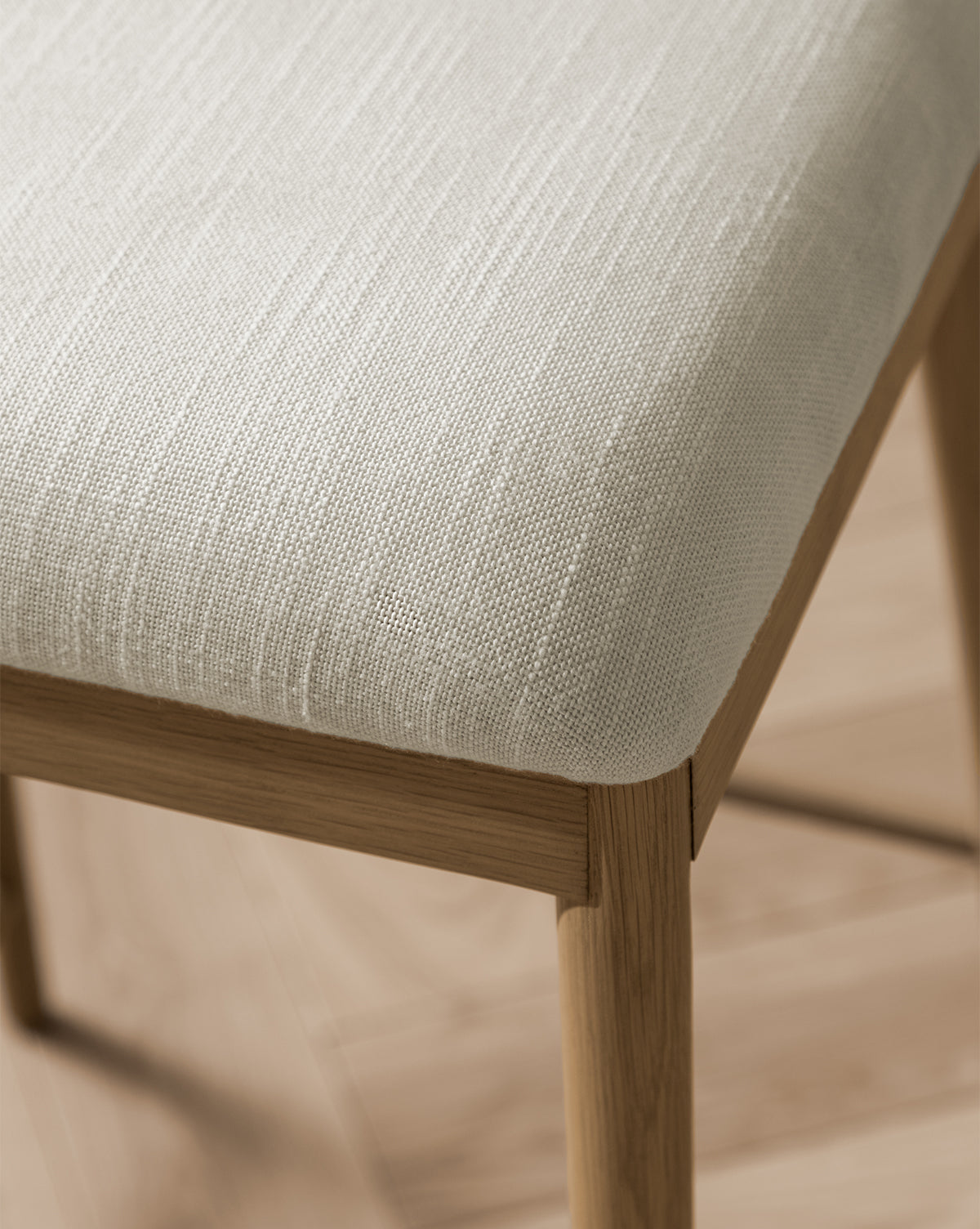 Close up Molly chair seat cushion in white textured fabric from Vendixs
