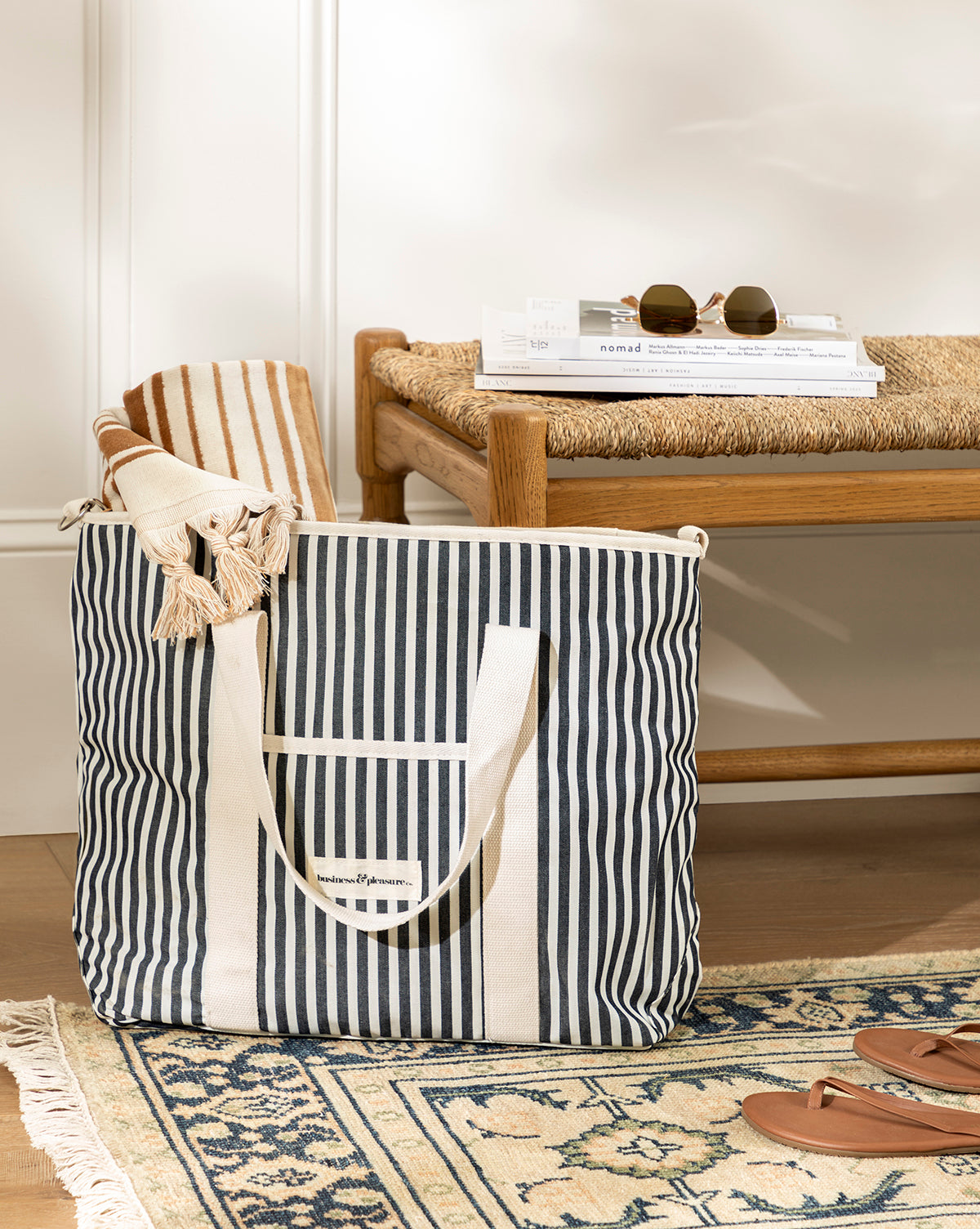 Navy Striped Cooler Bag with padded sides and waterproof interior, shown in a home entryway, from Vendixs