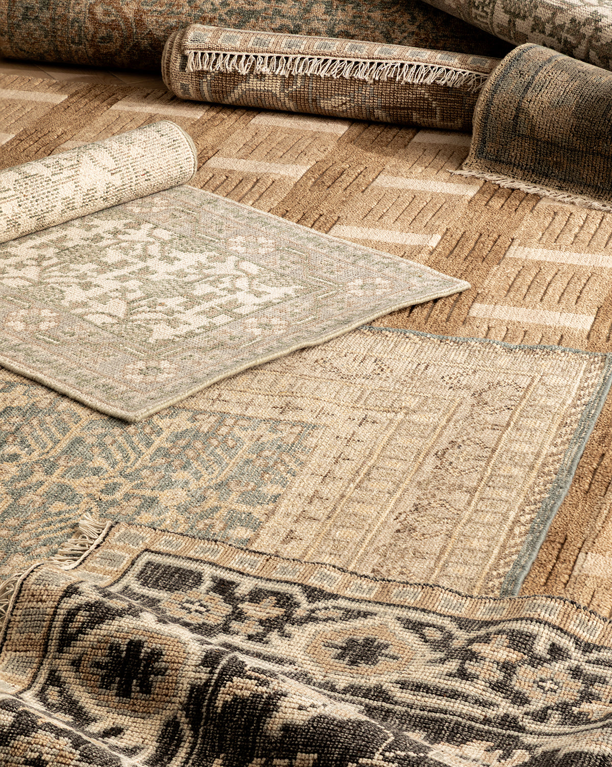 The Orsino Hand-Knotted Rug is displayed in earthy beige, brown, blue, and black tones, featuring geometric and intricate patterns that highlight its artisanal craftsmanship, by Vendixs