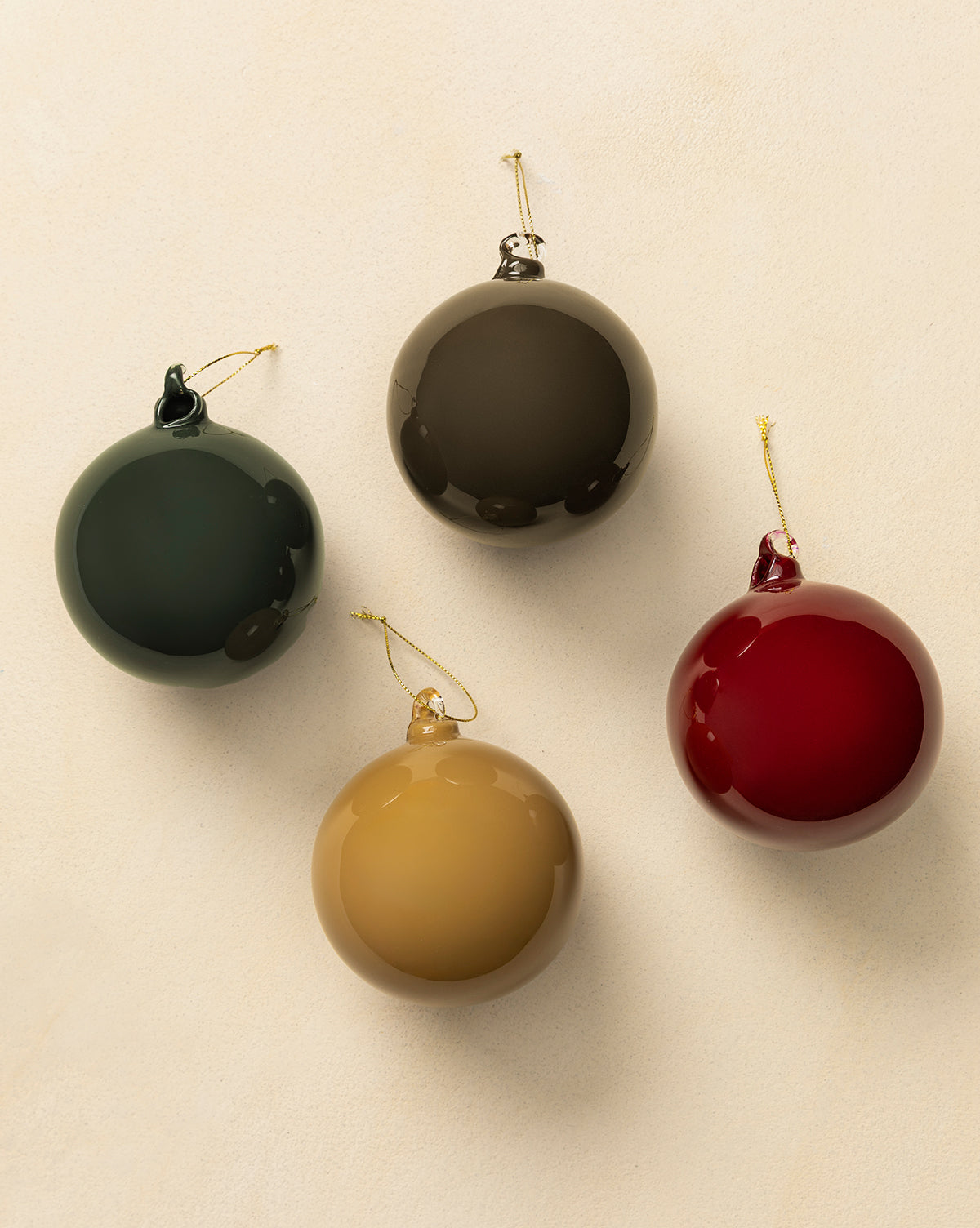 Each glass bauble has a gold hanging string—perfect for holiday decorating, by Vendixs