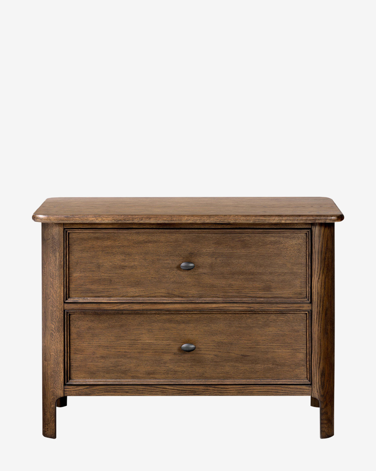 The Aeris Nightstand by Four Hands is a wooden two-drawer dresser with curved edges and dark metal knobs, ideal for bedroom organization or as a nightstand, shown standing on short legs against a plain white background. Vendixs