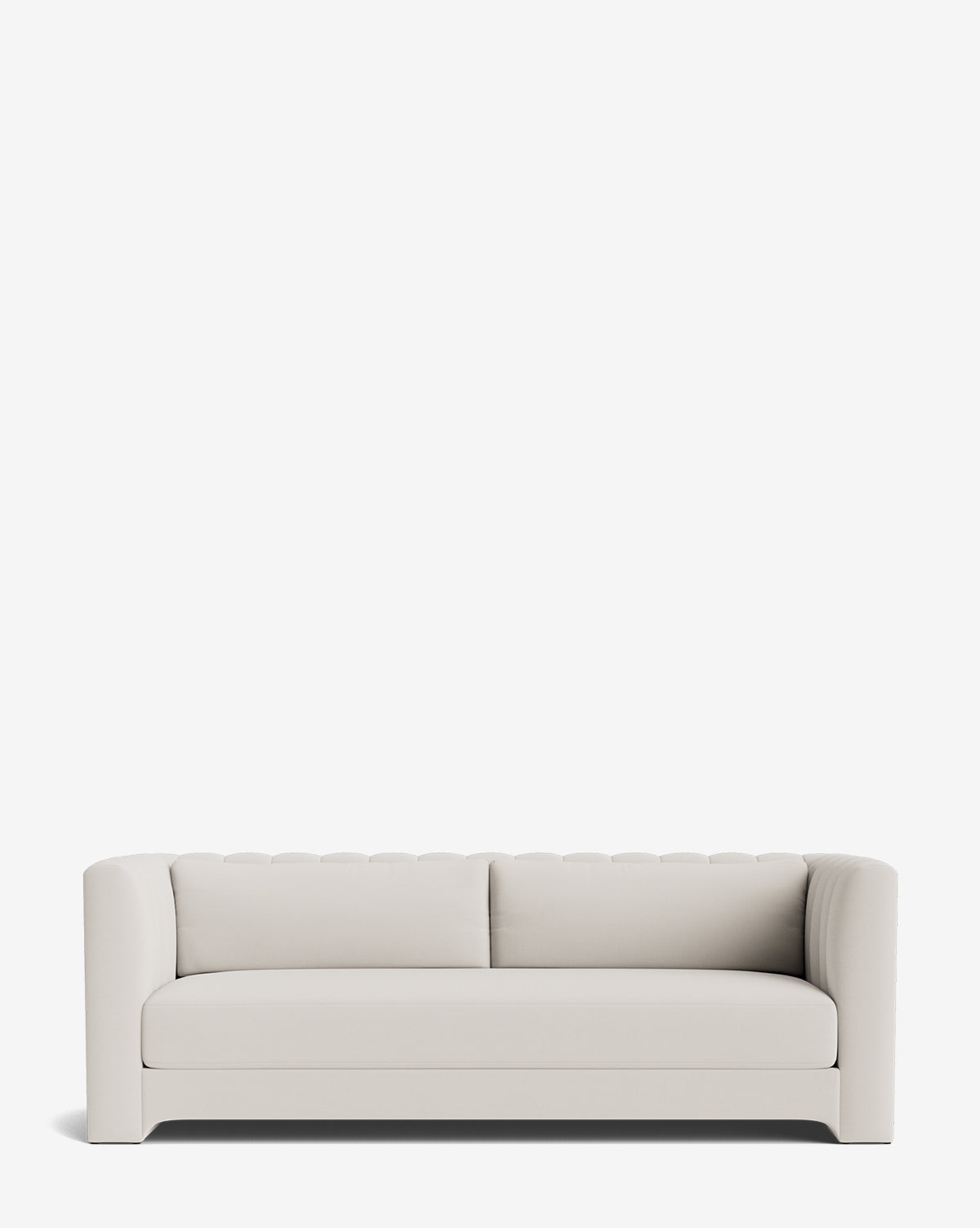 The Agatha Sofa 90 is a modern, minimalist white sofa inspired by Hollywood regency style, featuring a low back, rounded armrests, and smooth fabric upholstery set against a plain white background by Vendixs