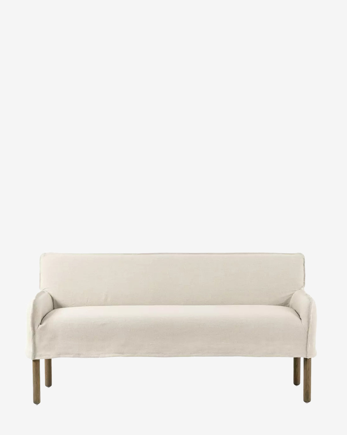The Aiken Slipcover Bench by Four Hands features a cushioned seat in off-white linen upholstery, minimalist modern design, and simple wooden legs, shown against a plain white background. Vendixs