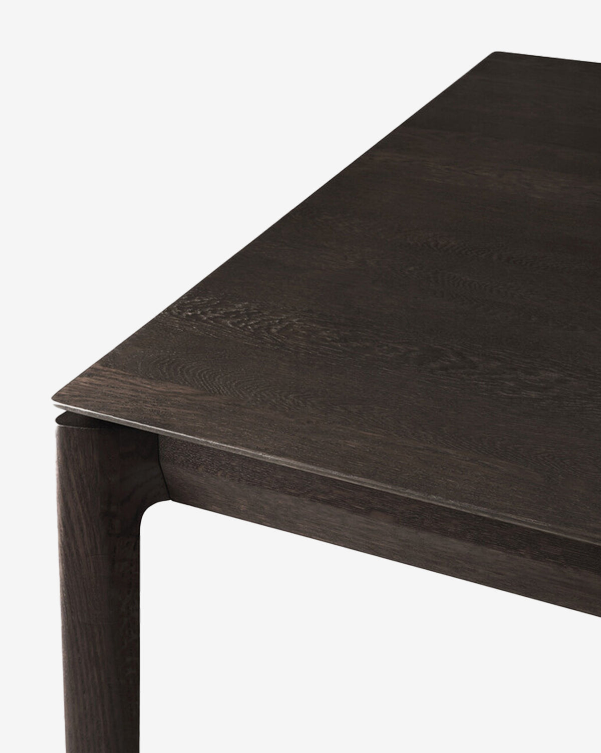 Close-up of the Alec Dining Table corner highlights its sturdy build, smooth flat surface, and subtly rounded legs against a plain white background—an ideal choice for any dining room, by McGee & Co.