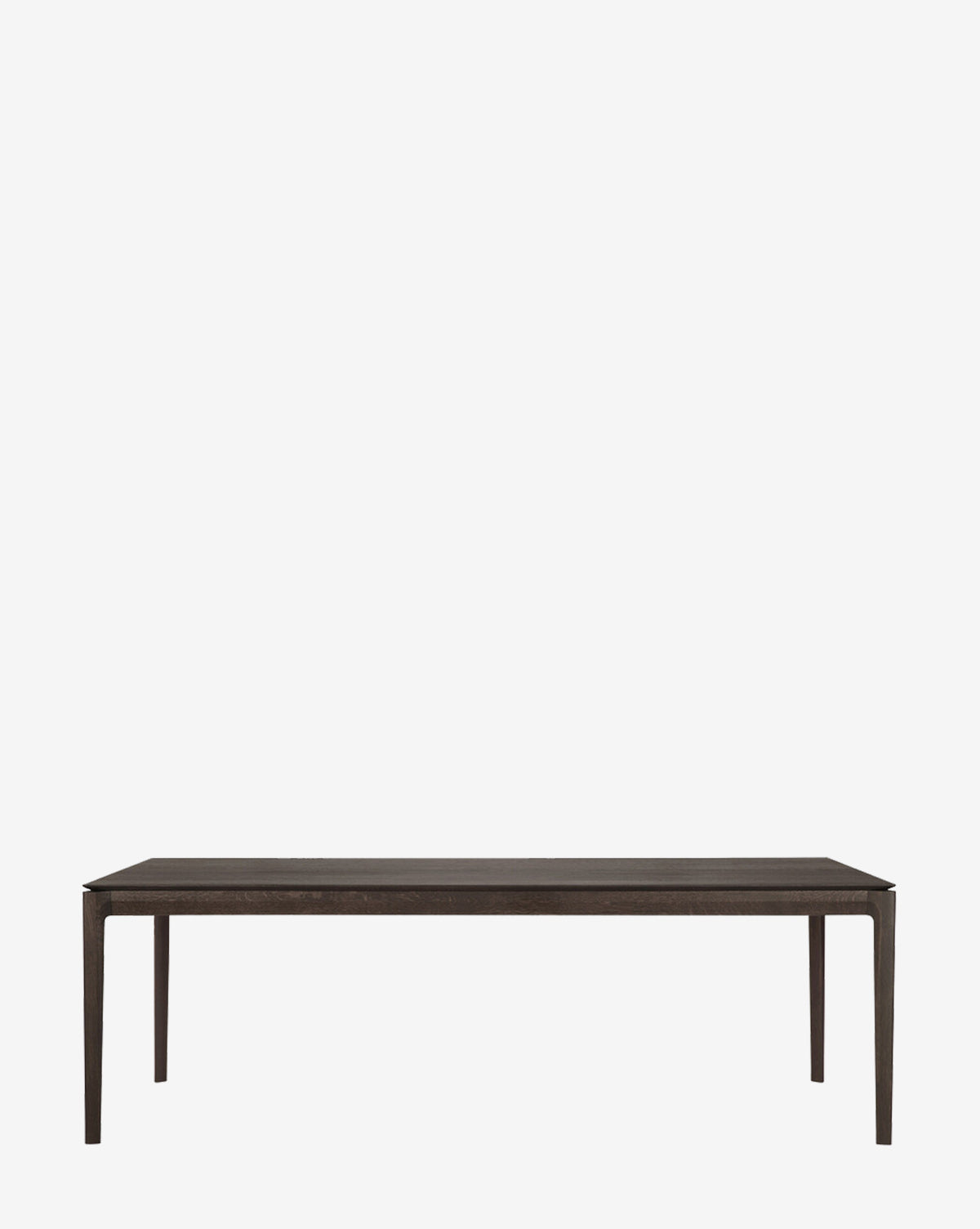 The Alec Dining Table boasts sturdy construction and a minimalist rectangular dark wood design with four slender legs, making it ideal for any modern dining room, by McGee & Co.