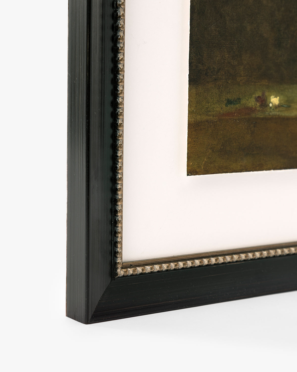 Close-up of the corner of a framed giclee print titled Antique Flower Vase with a black, textured frame and white mat showcasing part of the artwork in rich, dark, earthy tones by Vendixs