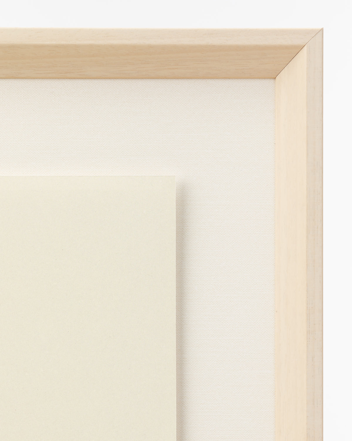 A close-up of a light wooden picture frame with an off-white mat and cream-colored paper displays the Apple Collage giclee print—perfect for children’s room art and shown against a white background, by Vendixs