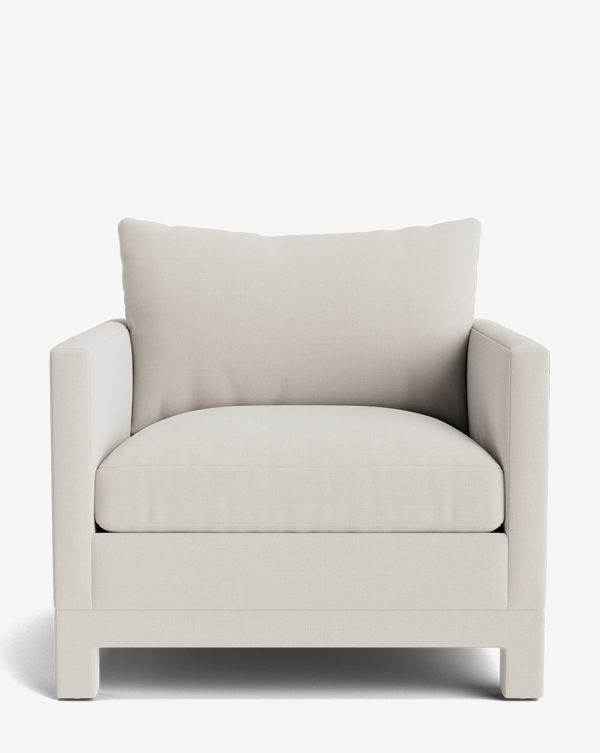 The Appoline Lounge Chair from our Upholstery Collection features a wide, boxy design, light beige fabric, a thick seat cushion, and a large matching back pillow, shown against a white background by McGee & Co.