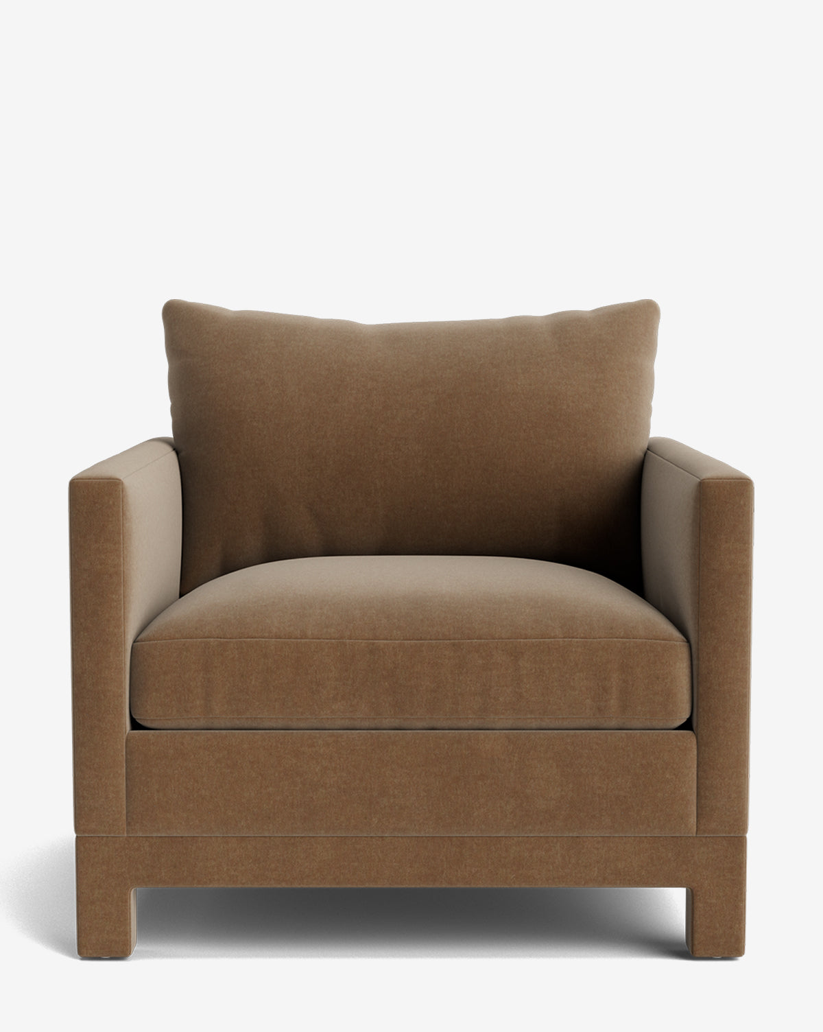 The Appoline Lounge Chair is a large, plush modern seat with a boxy shape, upholstered in light brown fabric. It features thick cushions, straight armrests, and short block legs from our Upholstery Collection on a white background by McGee & Co.