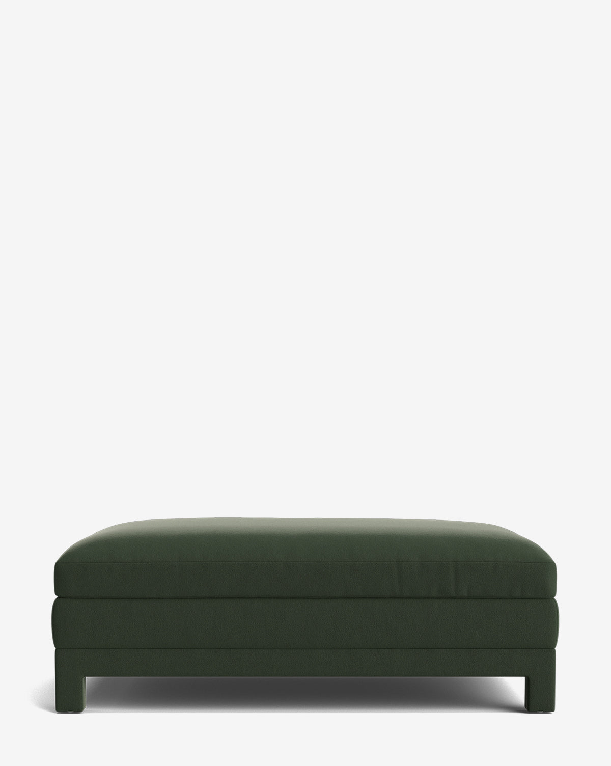 The Appoline Ottoman is a large, rectangular, modern ottoman in dark green with short legs, displayed against a plain white background by McGee & Co.