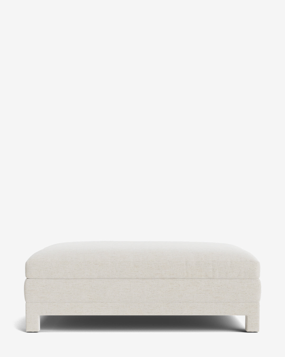 The Appoline Ottoman features a modern, rectangular, low-profile design with soft off-white upholstery, clean lines, a flat cushion top, short block legs, and comes against a plain white background by McGee & Co.