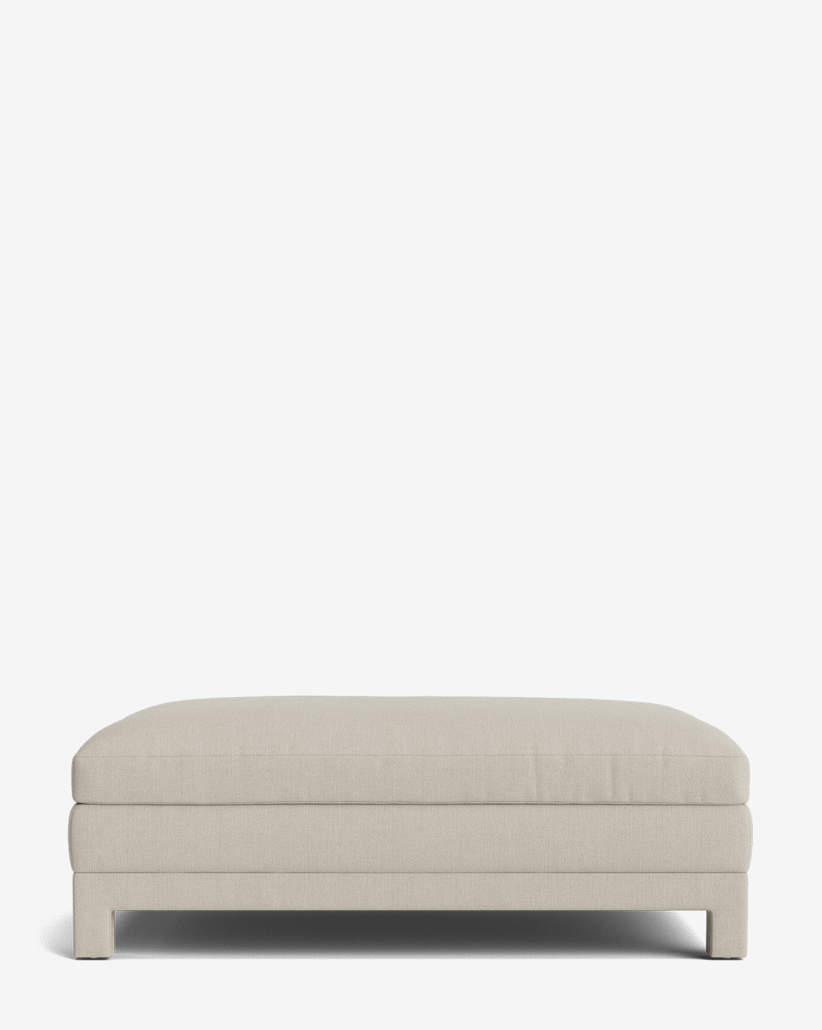 The Appoline Ottoman is a rectangular, light beige modern piece featuring clean lines and a low profile, shown against a plain white background by McGee & Co.