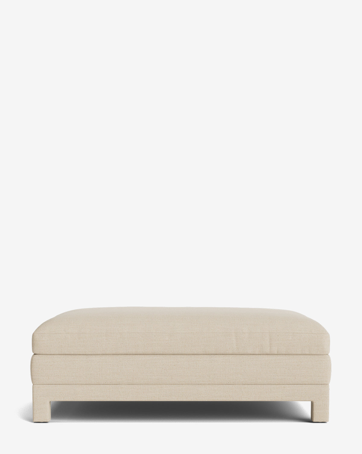 The Appoline Ottoman is a rectangular, low-profile upholstered piece in light beige fabric with short legs and a modern design, perfect for adding subtle sophistication to any space, by McGee & Co. Shown against a plain white background.