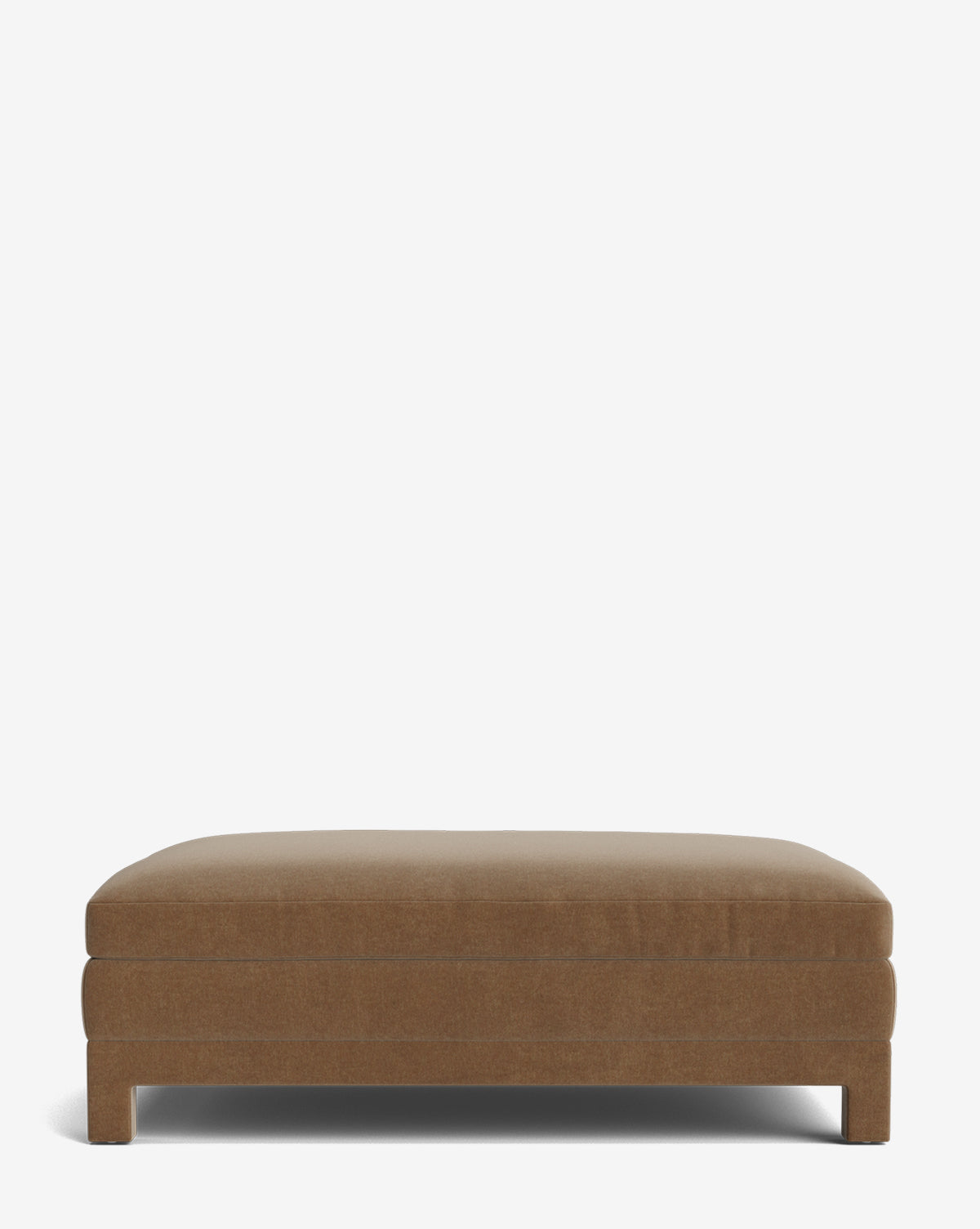 The Appoline Ottoman is a rectangular, brown modern piece with simple, clean lines and short legs, shown on a plain white background by McGee & Co.