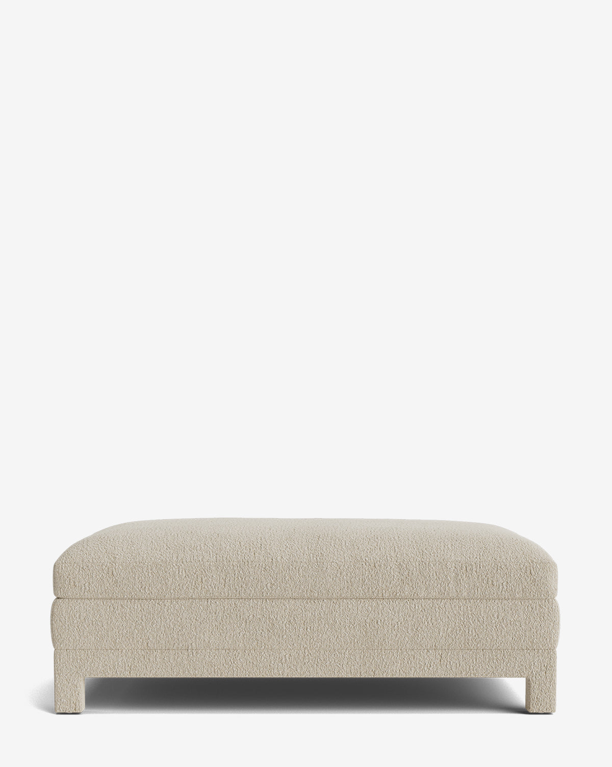 The Appoline Ottoman is a rectangular, light beige piece featuring short, sturdy legs and a simple modern design, shown against a plain white background by Vendixs
