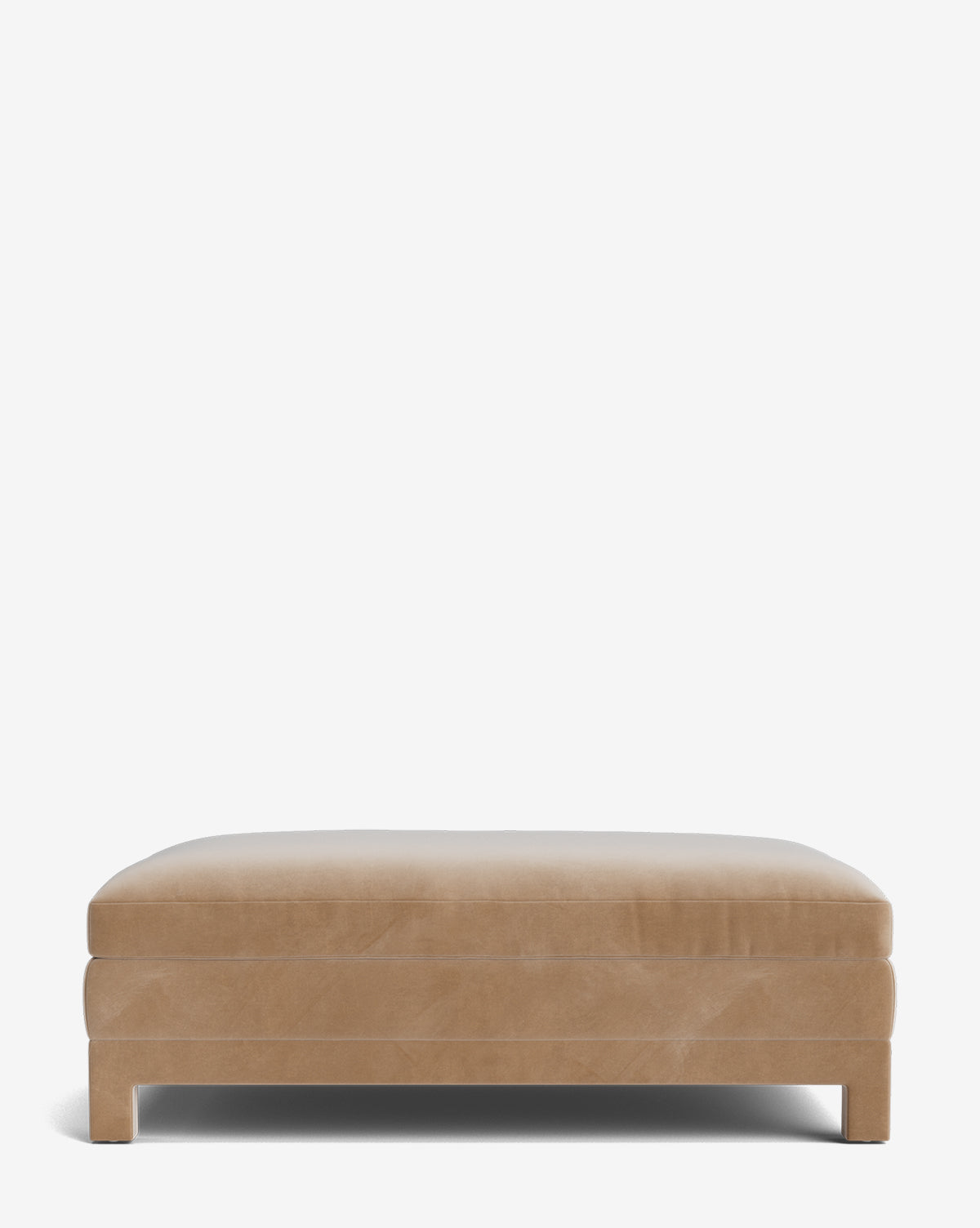 The Appoline Ottoman is a modern, rectangular ottoman with clean lines, tan upholstery, and short block legs, shown against a plain white background by McGee & Co.