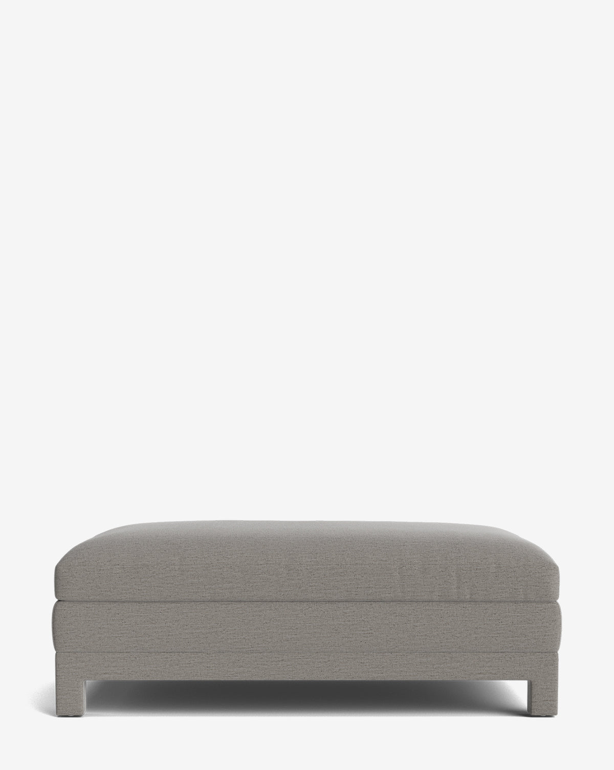 The Appoline Ottoman is a modern, rectangular upholstered piece with a low profile and plush cushioned top, shown against a plain white background by McGee & Co.