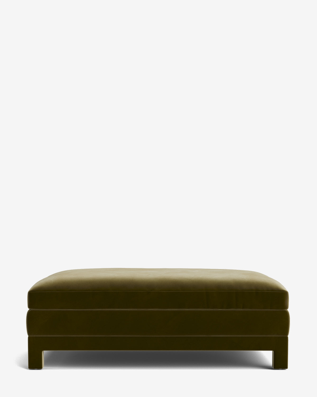 The Appoline Ottoman is a large, rectangular modern piece in olive green featuring a plush cushiony top and simple block legs, shown against a plain white background by McGee & Co.
