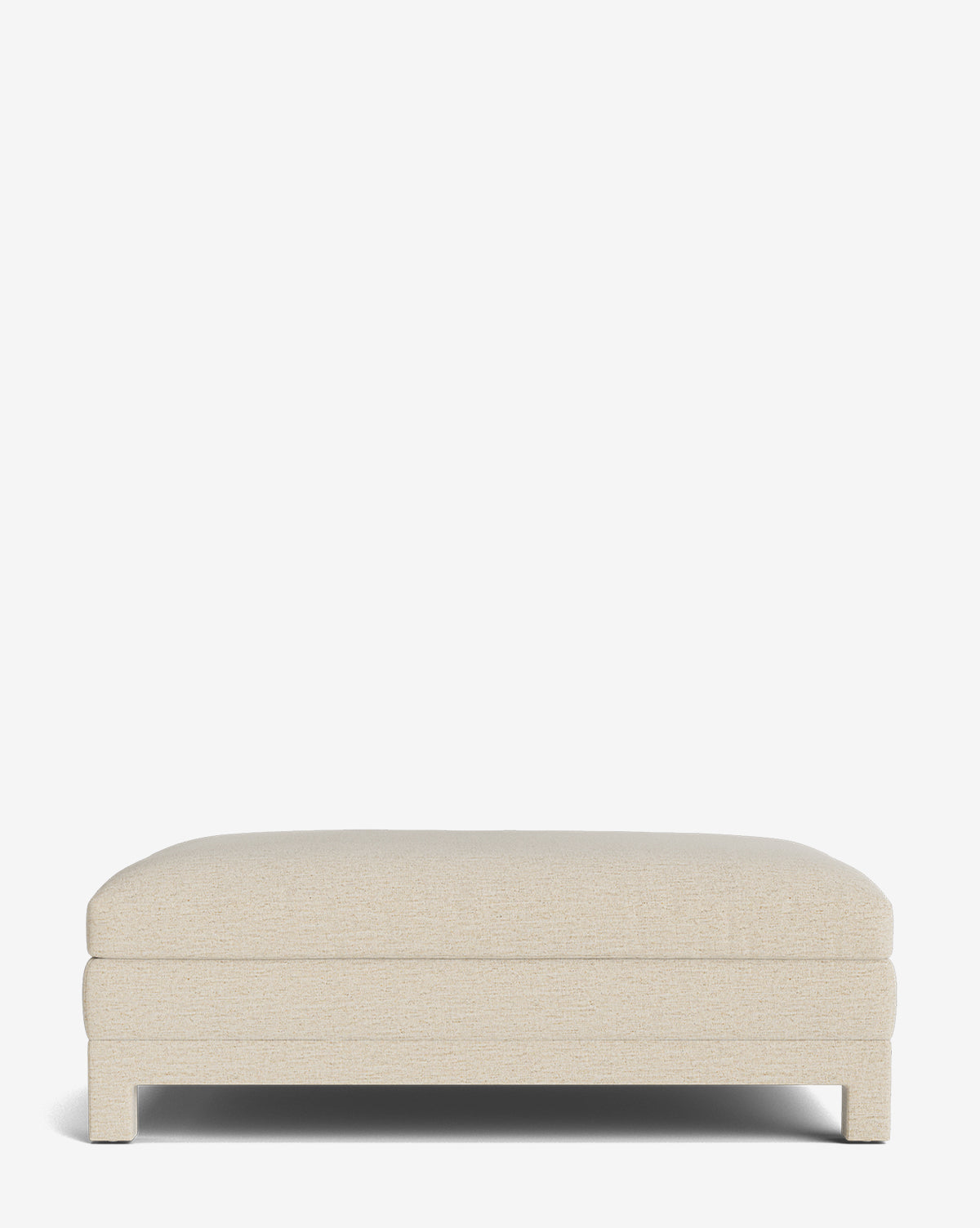 The Appoline Ottoman is a minimalist, rectangular piece with beige upholstery, a cushioned top, and short legs, displayed against a plain white background by McGee & Co.