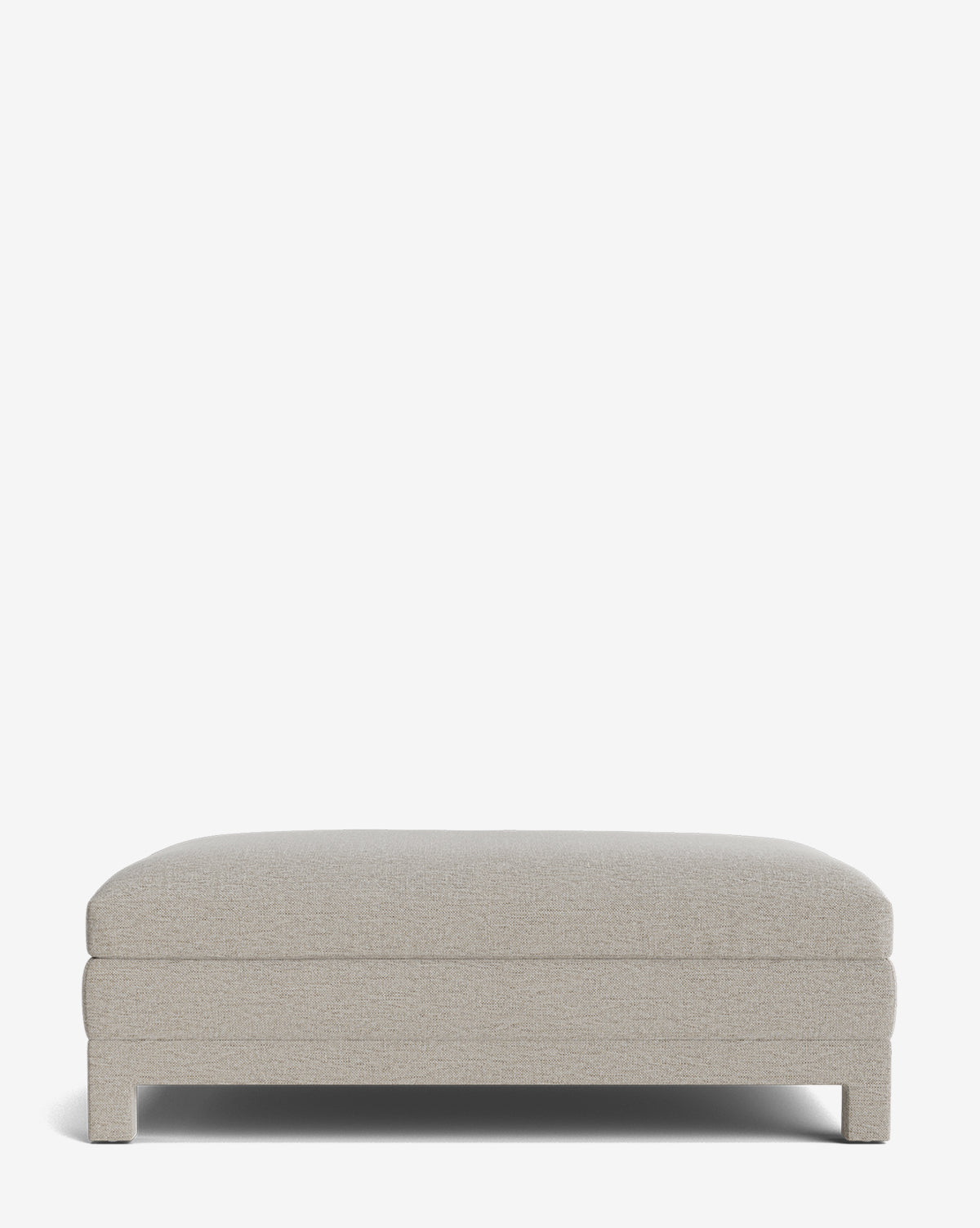The Appoline Ottoman features a minimalist rectangular design with light beige upholstery and short legs, displayed against a plain white background, by Vendixs