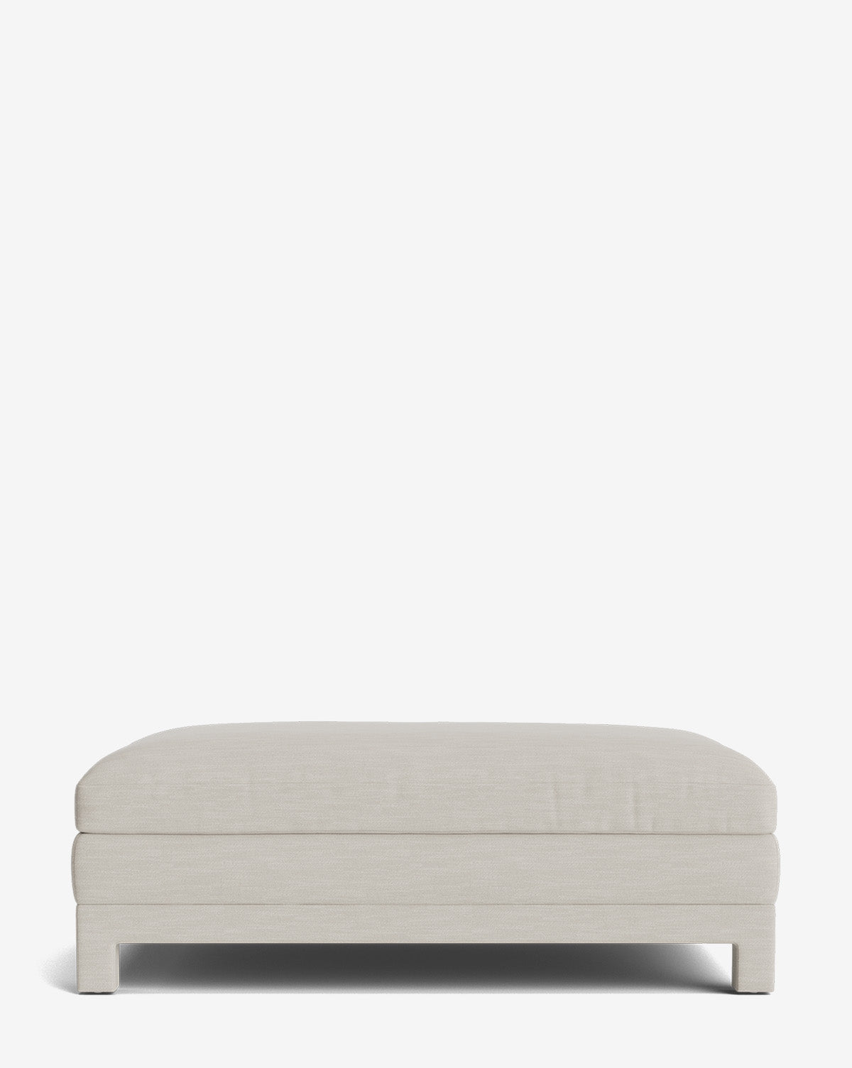 The Appoline Ottoman is a rectangular, light beige piece with short block legs, set against a plain white background. Its upholstered design offers comfort and modern style for any contemporary space, by Vendixs