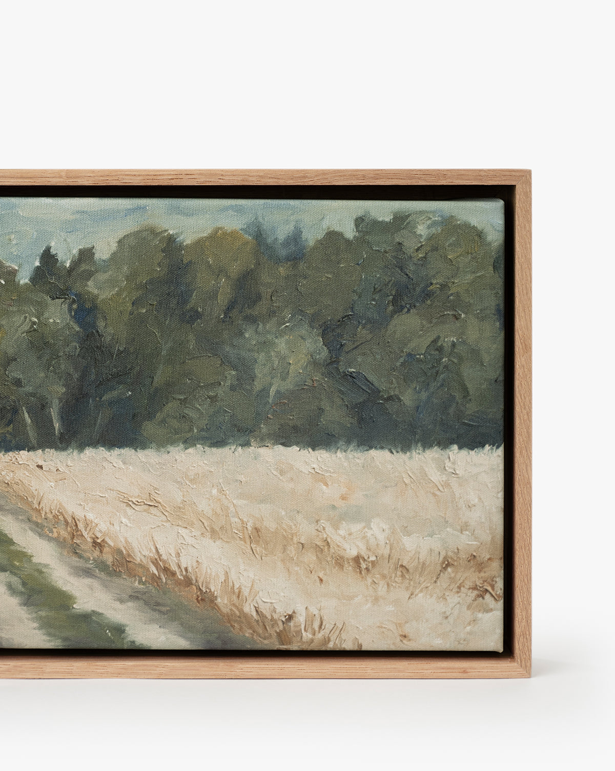 Around the Bend: A framed, gallery-quality landscape fine art print featuring a dirt path by a golden wheat field, with lush green trees and a cloudy sky in the background, by Vendixs