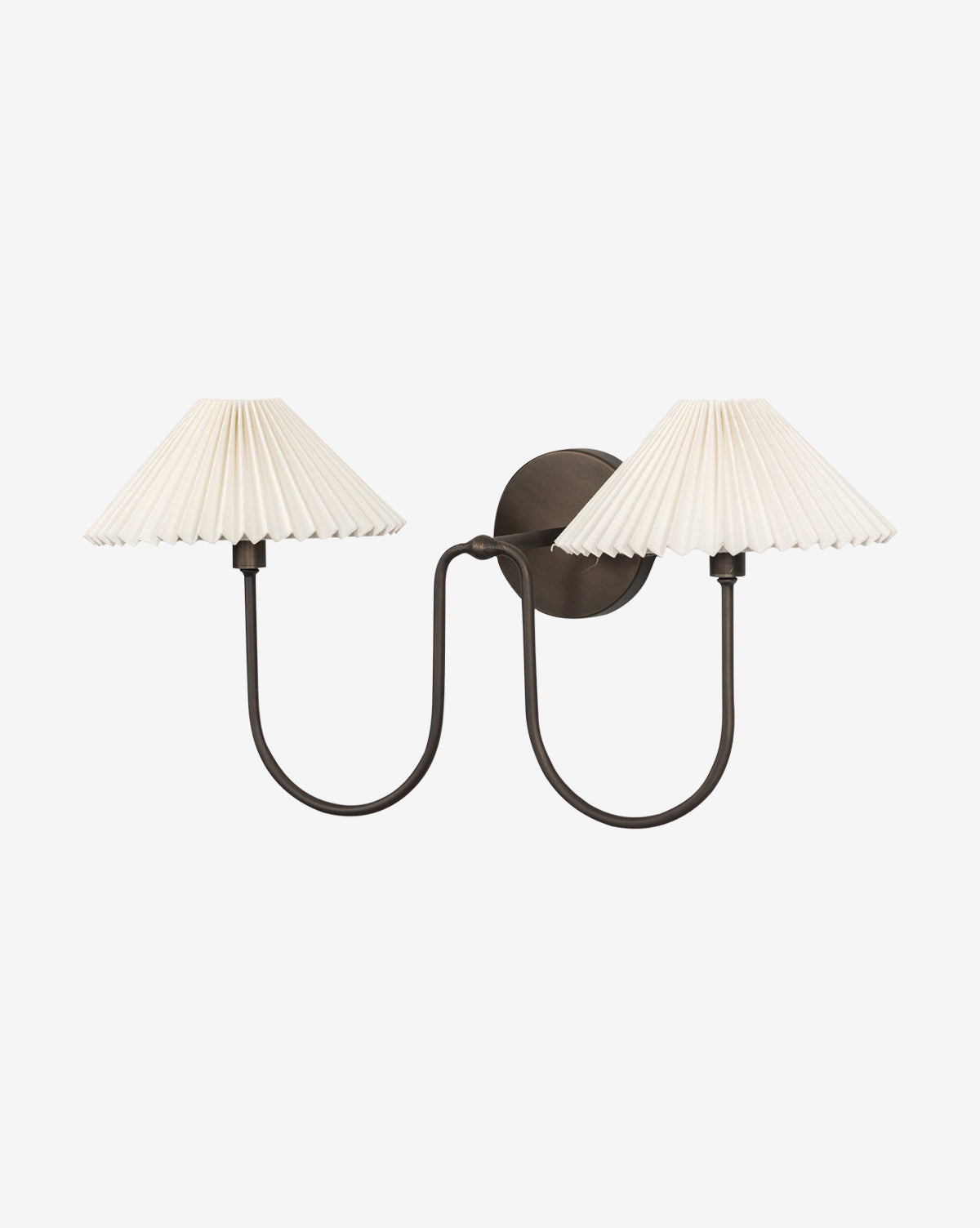 The Four Hands Ashby Double Sconce features two curved black metal arms in an oil-rubbed bronze finish with pleated white linen shades, offering a symmetrical look against a plain white background. Vendixs