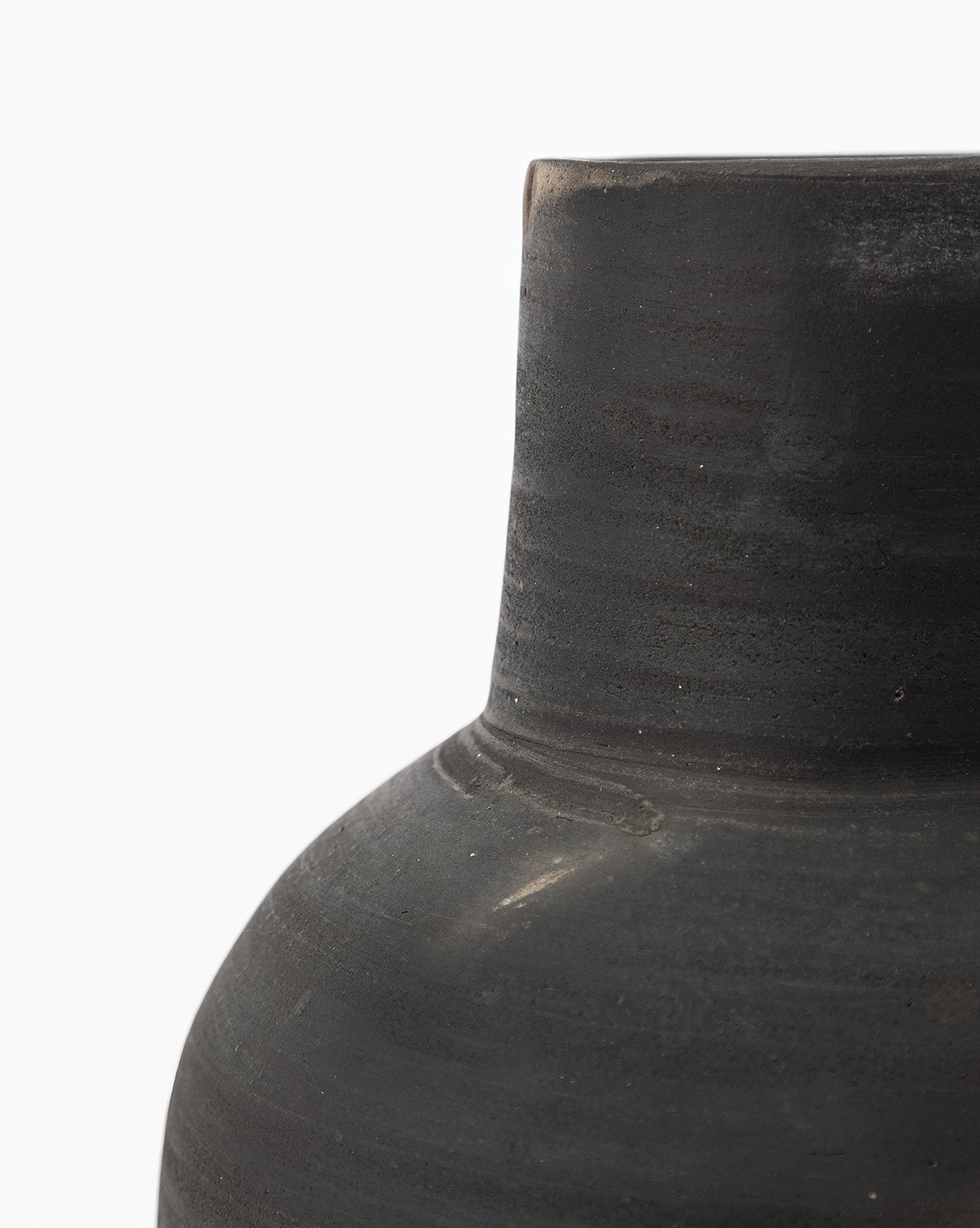 Close-up of the upper portion of the Auster Distressed Vase, featuring a smooth dark gray ceramic finish, cylindrical neck, and rounded shoulder, set against a plain white background, by Vendixs