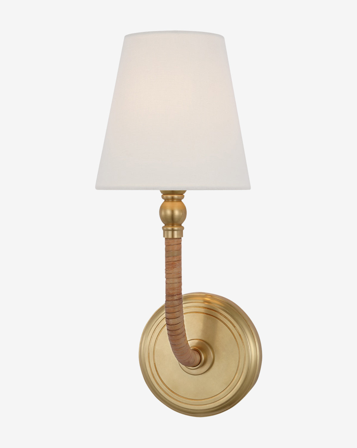 The Visual Comfort & Co. Signature Basden Medium Sconce is wall-mounted with a brass finish, round base, curved arm wrapped in tan material, and a white linen shade, offering a classic, elegant look. Vendixs