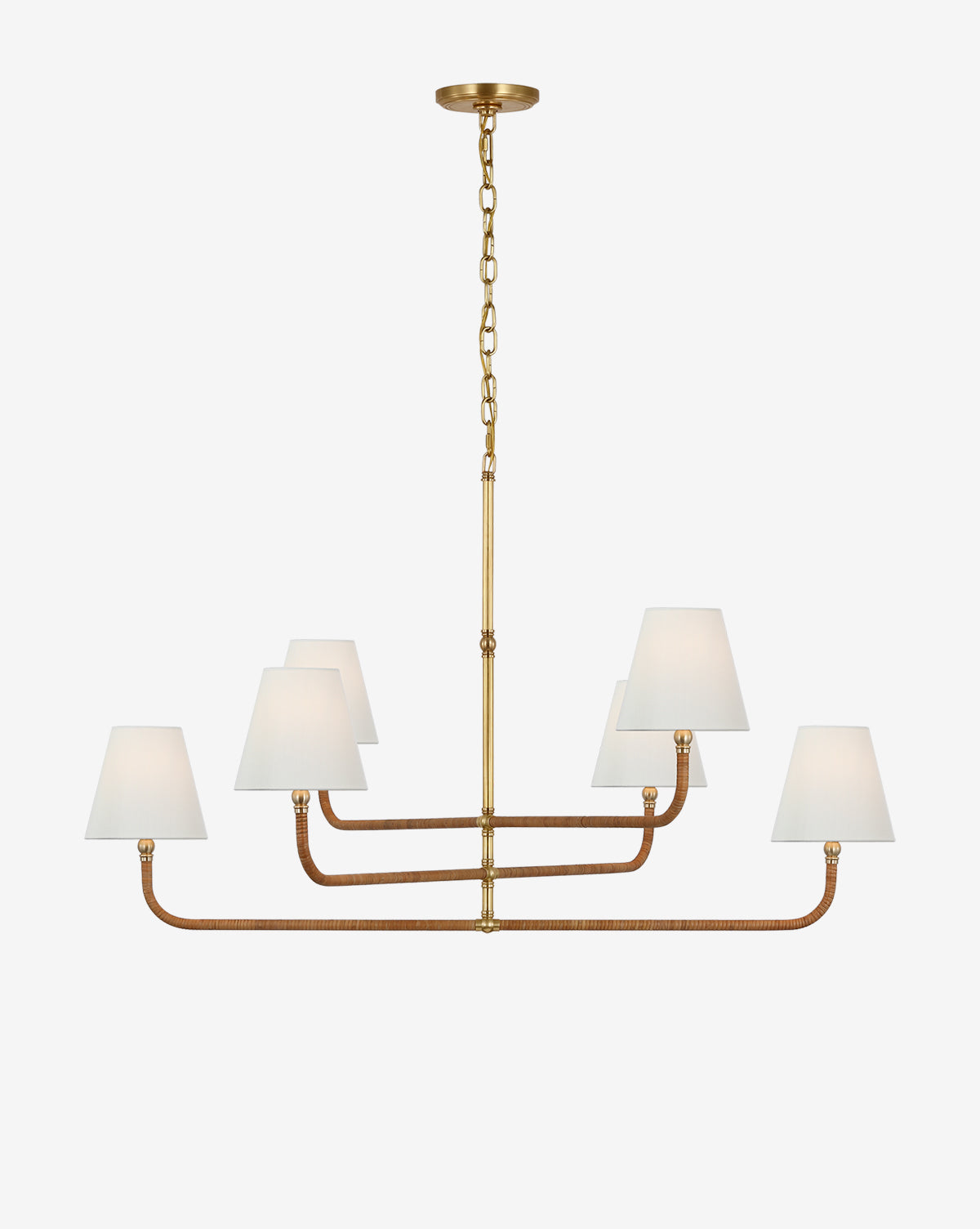 The Basden Three Tier Chandelier by Visual Comfort & Co. Signature features a gold and bronze finish with six white fabric shades in two rows, suspended by a chain—offering a modern take on the classic rattan chandelier. Vendixs
