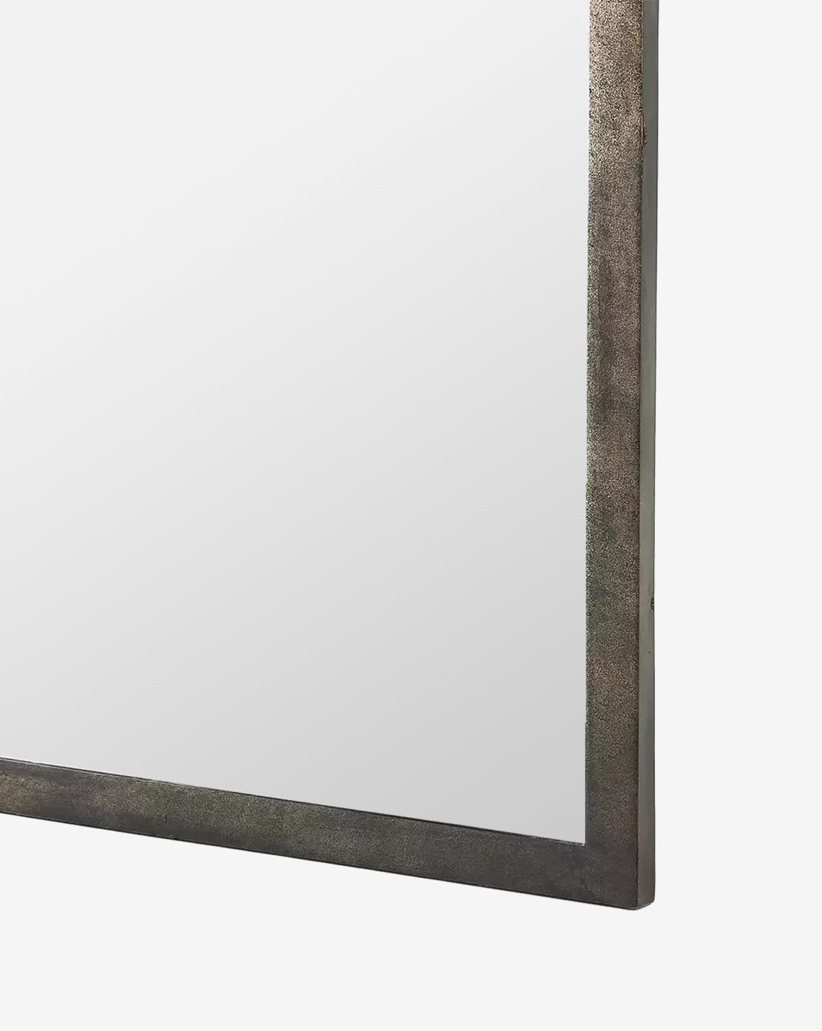 A close-up of the corner of the Beckington Floor Mirror, featuring a textured iron frame in a burnished charcoal finish, set against a plain white background, by Vendixs