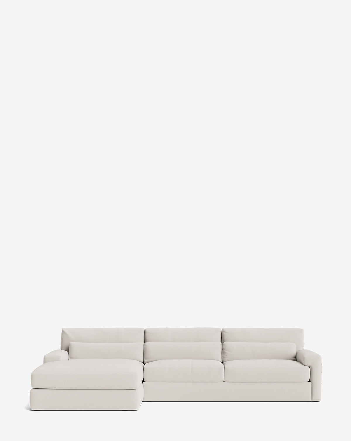 The Community Beckstead Chaise Sectional 128 is a modern, handcrafted light gray sofa with wide cushions and a left-side chaise lounge, shown against a plain white background. Vendixs