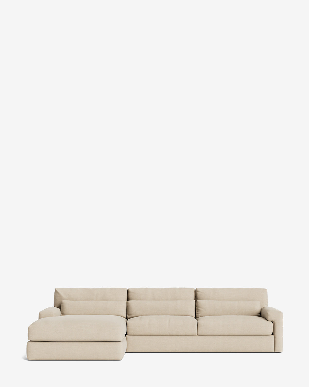 The Community Beckstead Chaise Sectional 128 features light beige upholstery, wide low-profile cushions, and a left chaise extension, shown against a plain white background. Vendixs