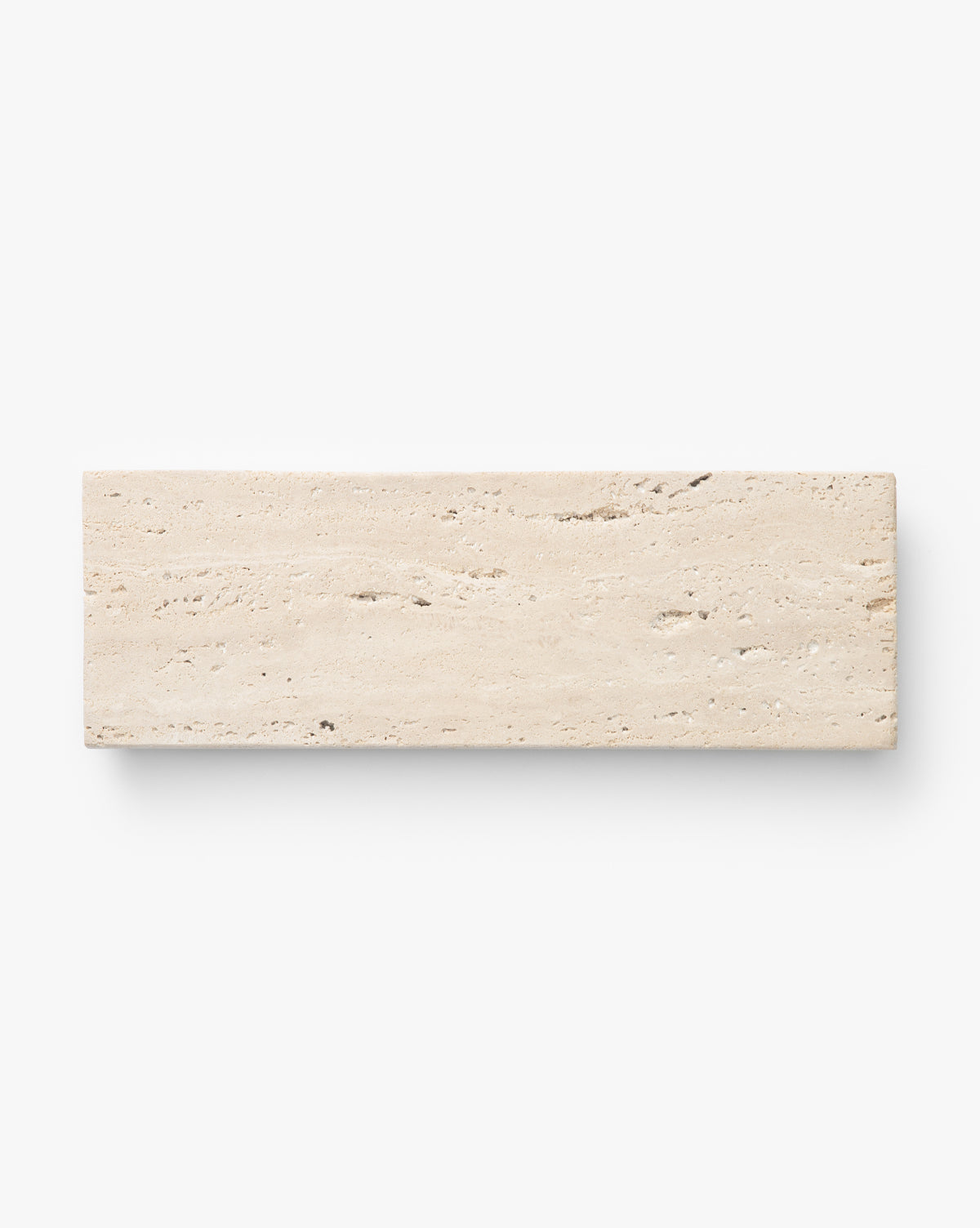 The Beige Travertine Footed Serving Board features a rectangular shape, rough textured surface, and natural horizontal veins, shown against a plain white background, by Vendixs