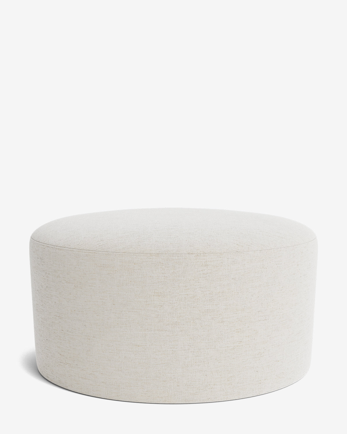 The Makerspalm Bellamy Ottoman is a simple, round piece in light beige fabric with a smooth surface and no visible legs or embellishments, shown against a plain white background. Vendixs