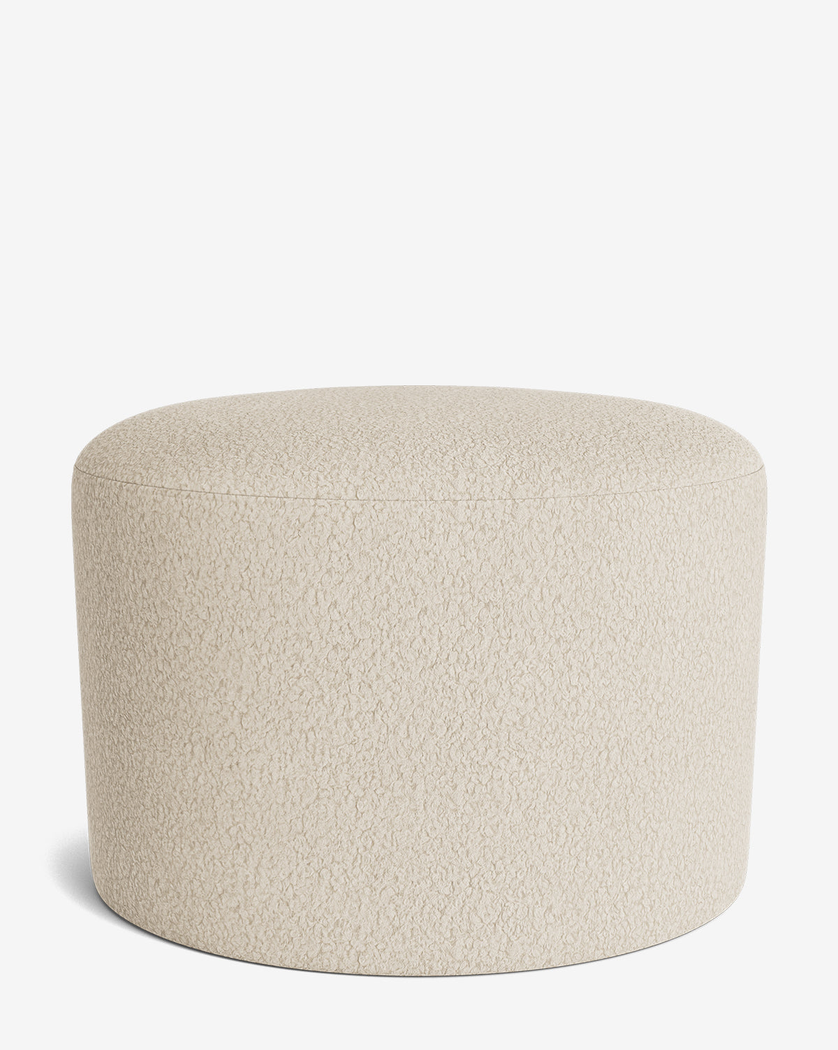The Makerspalm Bellamy Ottoman is a round, beige ottoman with a textured fabric surface, displayed against a plain white background—an adaptable accent for any room. Vendixs