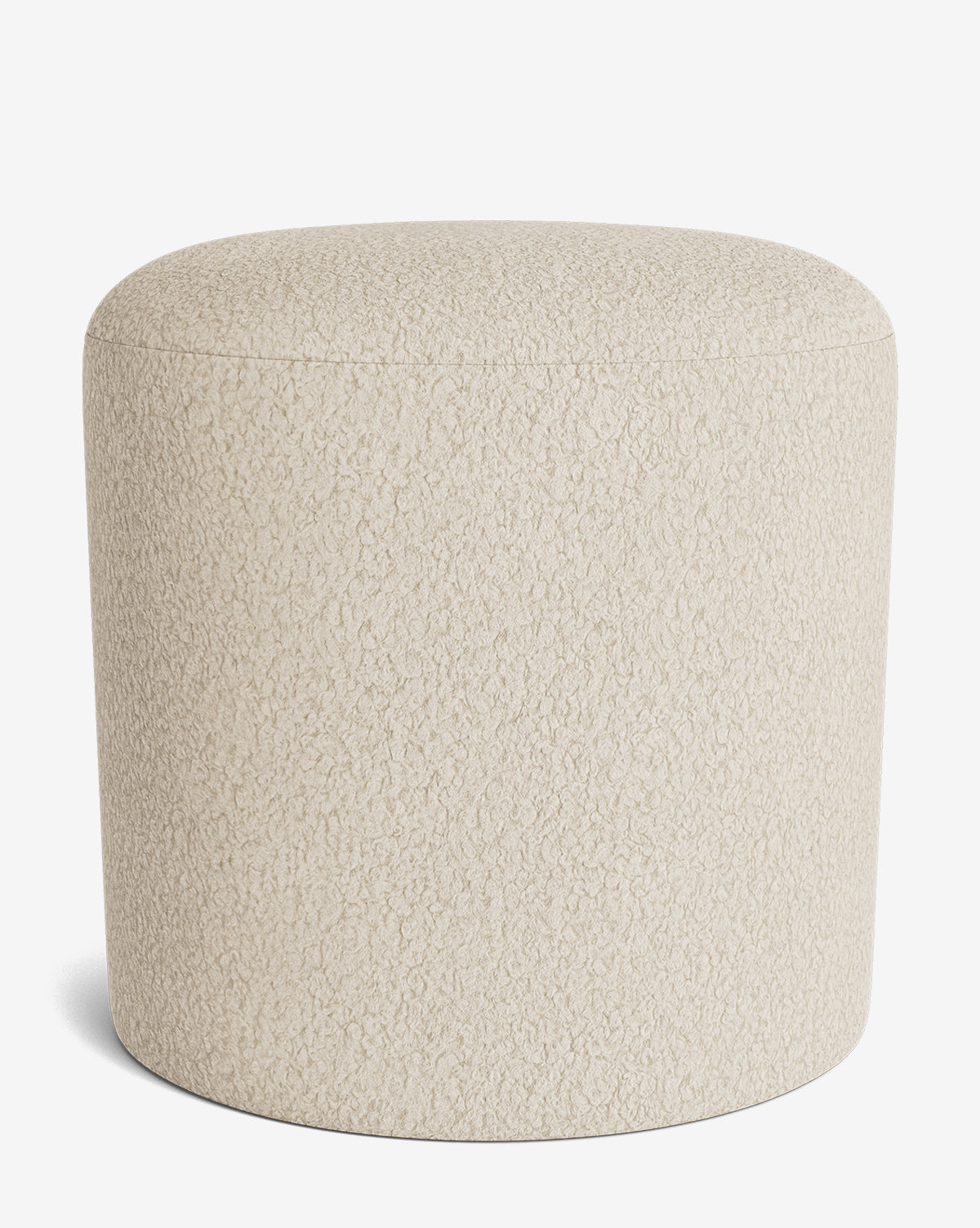 The Makerspalm Bellamy Ottoman is a round, beige ottoman with textured fabric, displayed on a white background. This versatile piece brings both style and function to any room. Vendixs