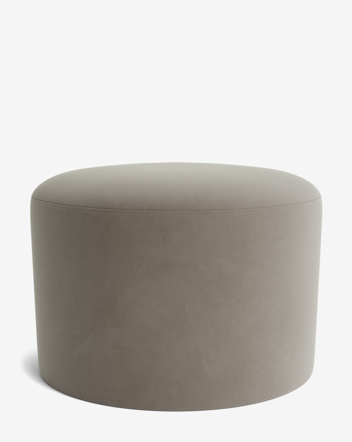 The Makerspalm Bellamy Ottoman is a round, taupe upholstered piece with a smooth, minimalist design, offering elegant versatility and functionality for any space. Shown here against a plain white background. Vendixs