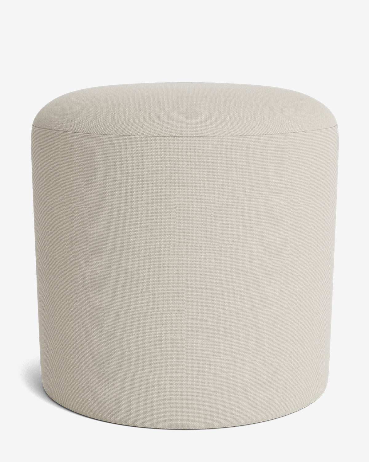 The Makerspalm Bellamy Ottoman is a simple, round piece in light beige with smooth upholstered fabric and no visible legs, shown against a white background. Vendixs