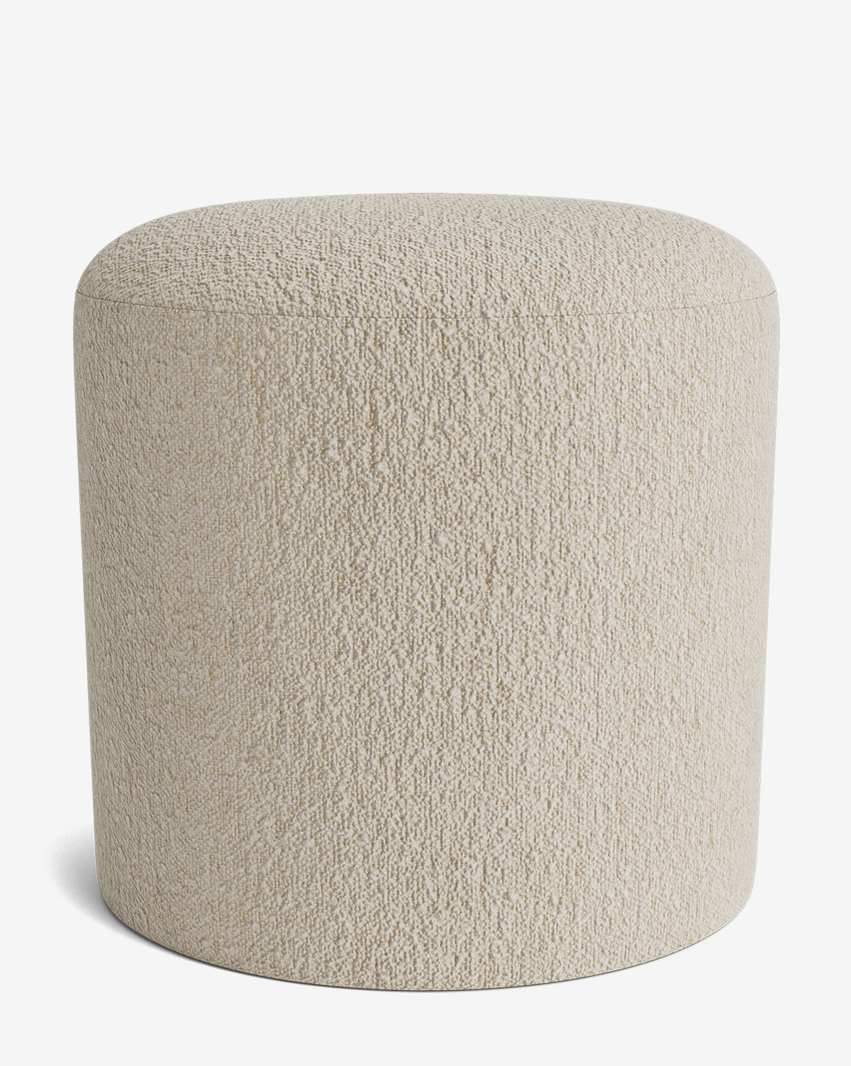The Makerspalm Bellamy Ottoman is a round, light beige ottoman with a textured fabric surface. Its simple, modern design without visible legs makes it a versatile accent for any space. Shown against a plain white background. Vendixs