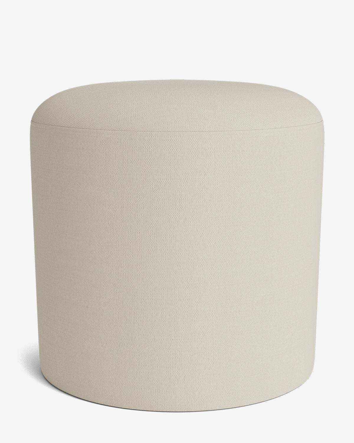 The Makerspalm Bellamy Ottoman is a beige, cylindrical upholstered piece with a smooth, rounded top and minimalist design, perfect for complementing any modern interior. Vendixs