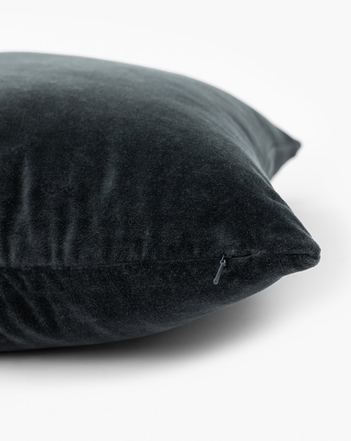 Close-up of the Bellevue Velvet Pillow Cover in dark gray stone-washed velvet, featuring a visible zipper, by Vendixs