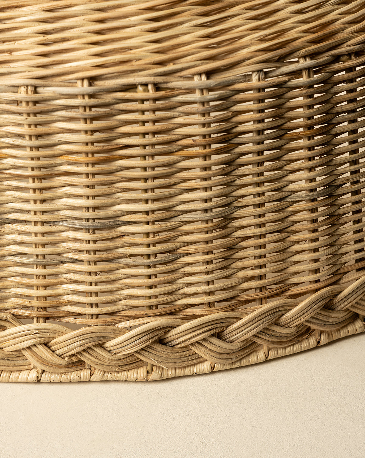 Close-up of the Braided Wicker Collar reveals detailed interlaced patterns and a decorative braided collar along the bottom edge. Natural beige and light brown tones emphasize the rich texture, by Vendixs
