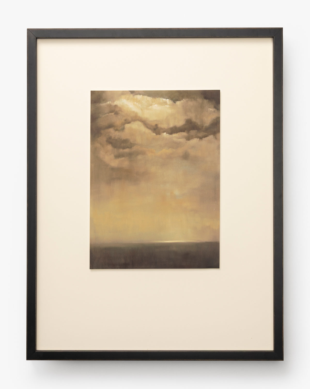 Bright Horizons by Donna Thomas, a framed giclée print featuring a cloudy sky with warm golden and brown tones at sunset or sunrise, hangs centered on a light background. The soft horizon near the bottom enhances this elegant wall art, by Vendixs