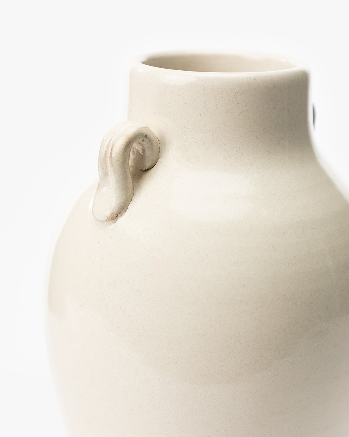 Close-up of the Brinkerhoff Two Handled Vase, cream-colored with small handles on its neck, set against a plain white background, by Vendixs