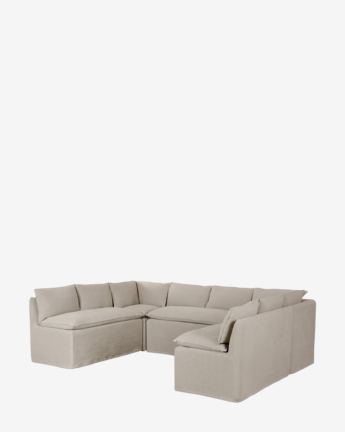 The Brookings Slipcover Corner is a light beige linen blend sofa with plush cushions and a low backrest, shown against a plain white background by McGee & Co.