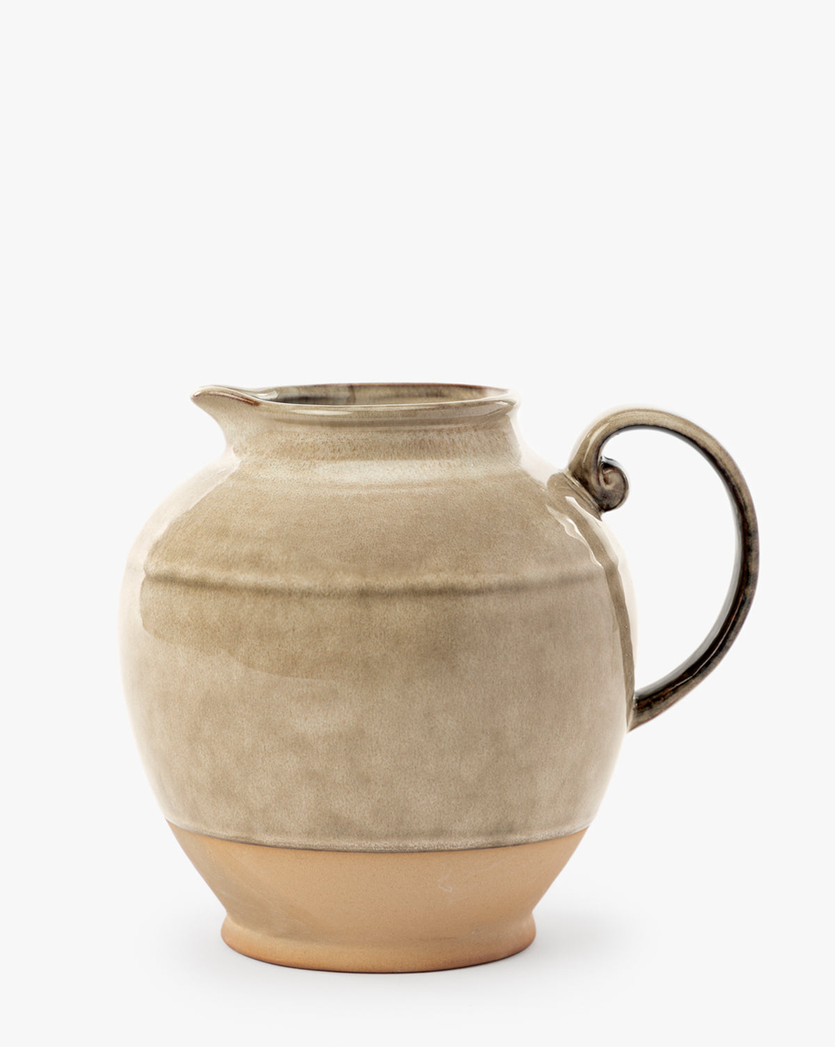 The Brown Stoneware Pitcher features a round shape, small spout, single curved handle, and a slightly matte beige finish. Its unglazed base reveals natural clay—ideal for kitchen styling against a plain white background, by Vendixs