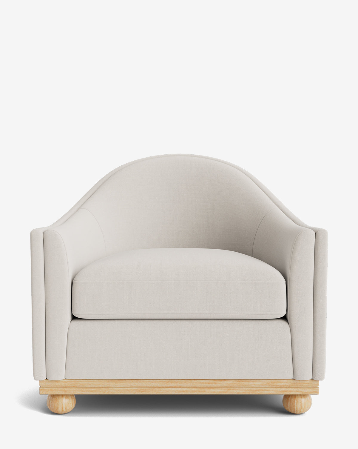 The Test Bunnell Lounge Chair (Copy) is a modern, customizable lounge chair with light beige upholstery, curved backrest, thick seat cushion, and a light wooden base—ideal for made-to-order furniture fans by McGee & Co.